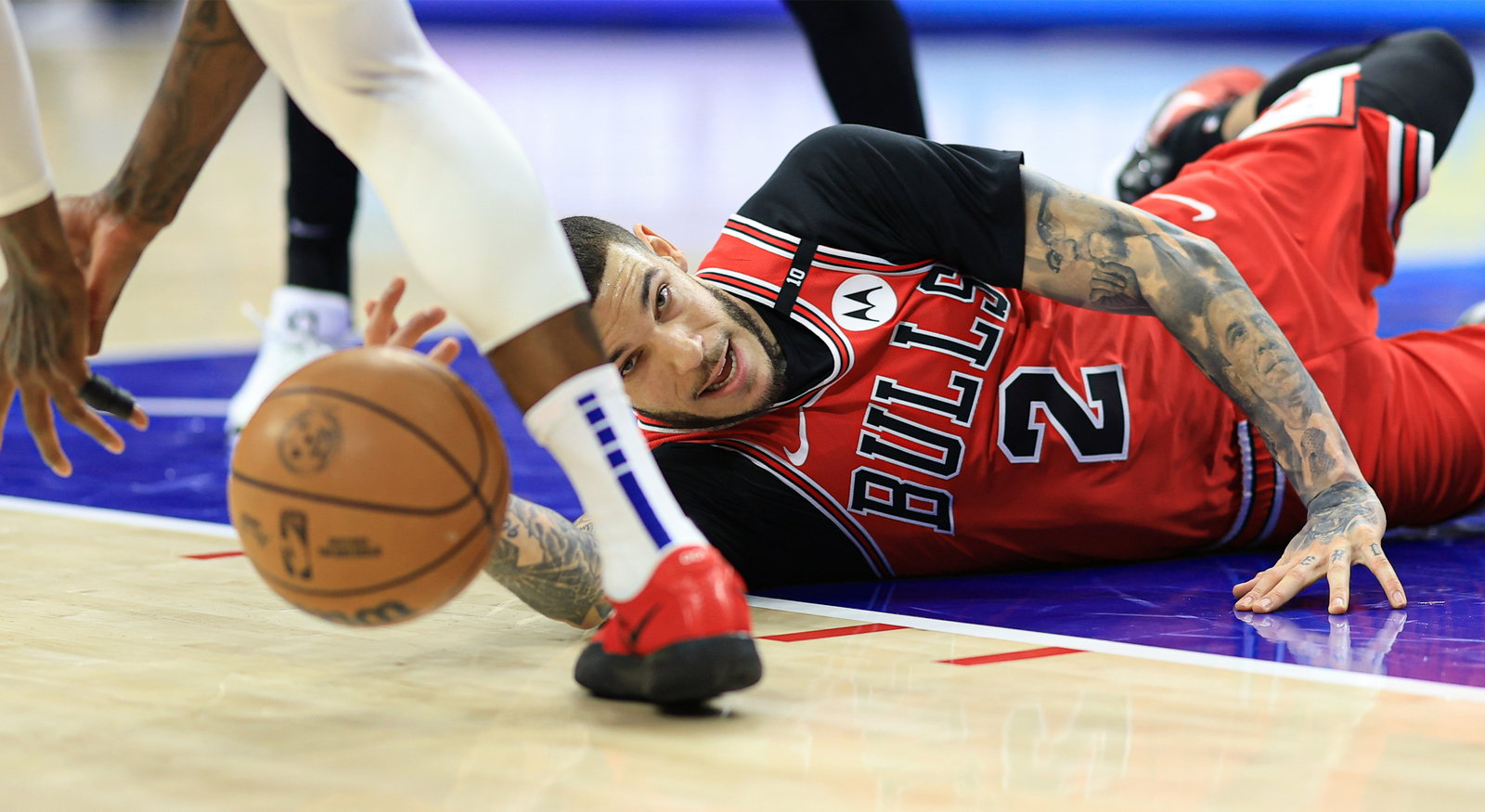 New Cavaliers Guard Lonzo Ball dives for a loose ball during a game.