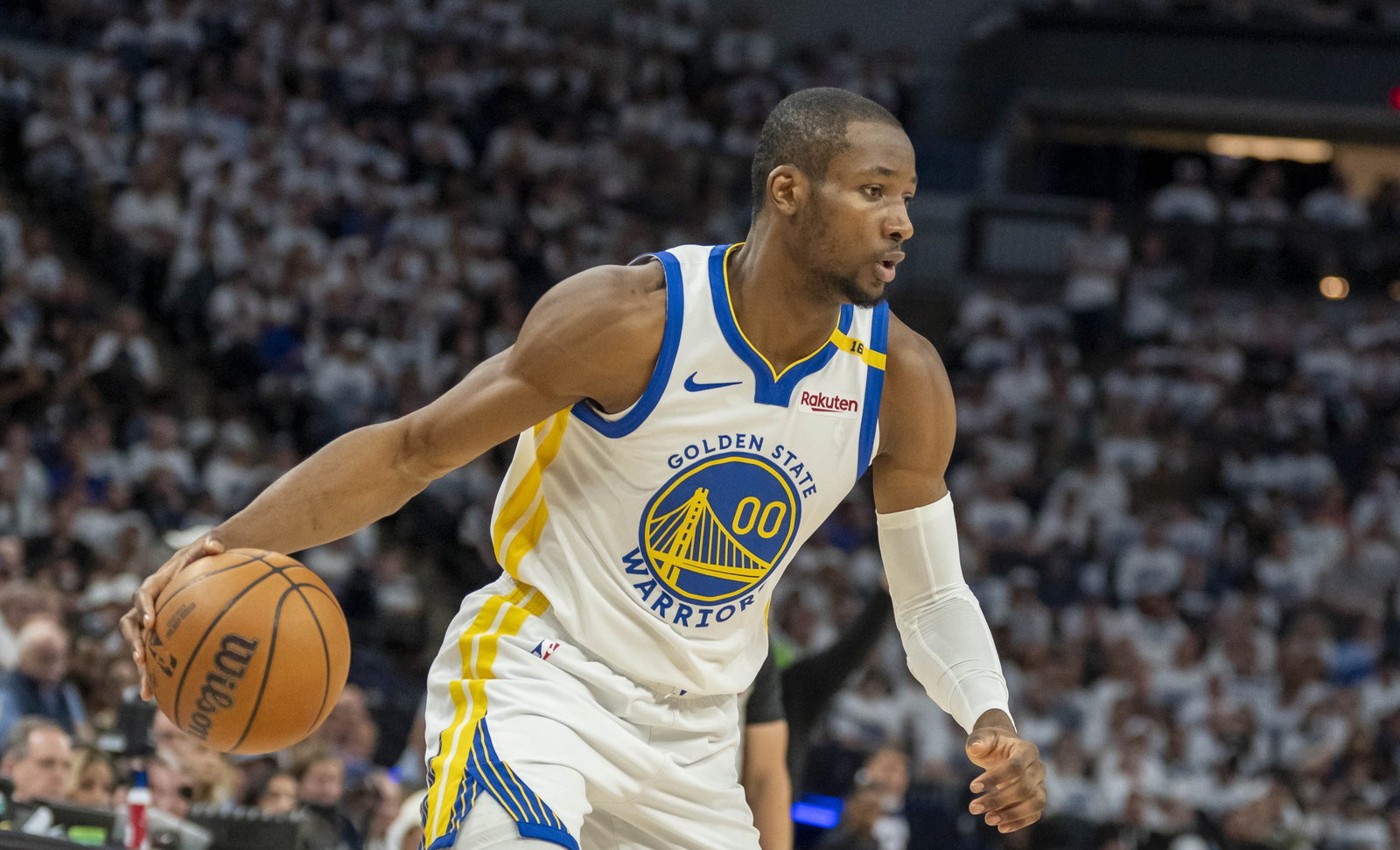 May 8, 2025; Minneapolis, Minnesota, USA; Golden State Warriors forward Jonathan Kuminga (00) dribbles the ball against the Minnesota Timberwolves in the second half during game two of the second round for the 2025 NBA Playoffs at Target Center. Mandatory Credit: Jesse Johnson-Imagn Image