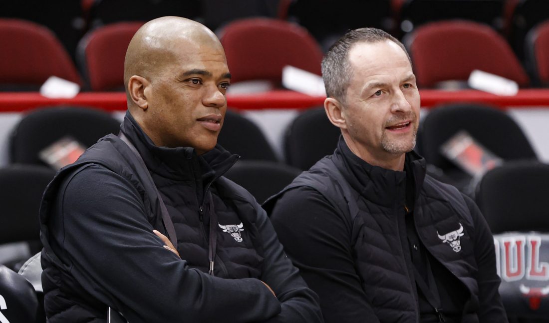 Apr 22, 2022; Chicago, Illinois, USA; Chicago Bulls executive vice president of basketball operations Arturas Karnisovas (right) talks with general manager Marc Eversley (left) before game three of the first round for the 2022 NBA playoffs against the Milwaukee Bucks at United Center.