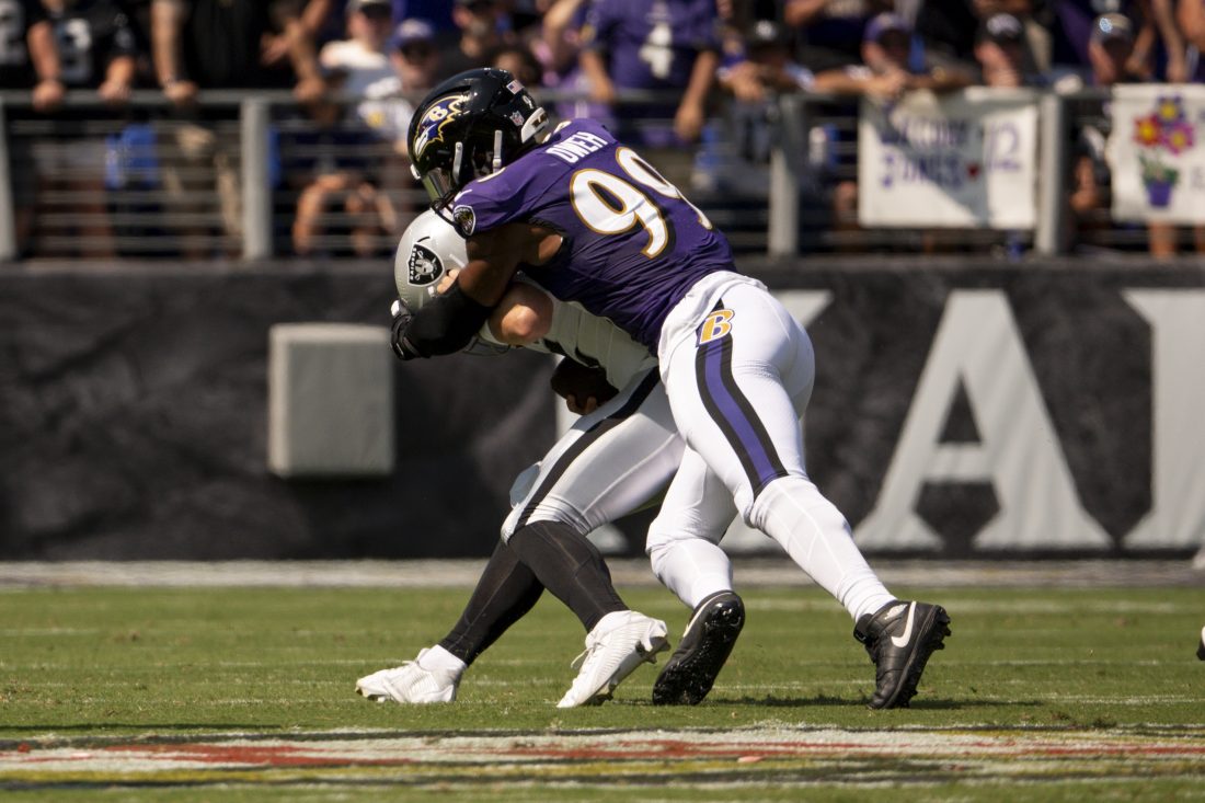 Sep 15, 2024; Baltimore, Maryland, USA; Baltimore Ravens linebacker Odafe Oweh (99) sacks Las Vegas Raiders quarterback Gardner Minshew (15) during the first quarter at M&T Bank Stadium. Mandatory Credit: Tommy Gilligan-Imagn Images