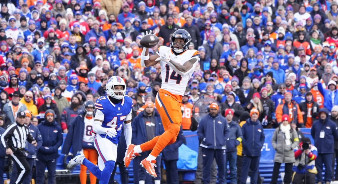 Jan 12, 2025; Orchard Park, New York, USA; Denver Broncos wide receiver Courtland Sutton (14) catches a pass during the first quarter against the Buffalo Bills in an AFC wild card game at Highmark Stadium.