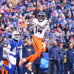 Jan 12, 2025; Orchard Park, New York, USA; Denver Broncos wide receiver Courtland Sutton (14) catches a pass during the first quarter against the Buffalo Bills in an AFC wild card game at Highmark Stadium.
