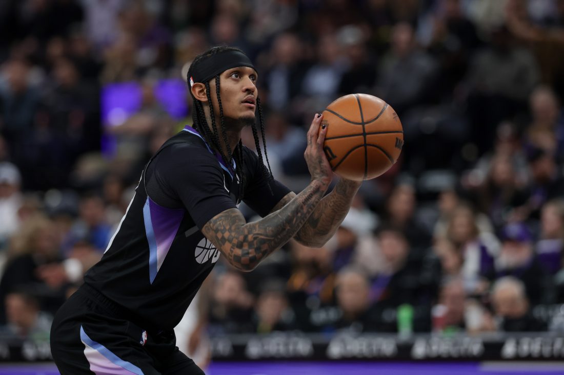 Feb 5, 2025; Salt Lake City, Utah, USA; Utah Jazz guard Jordan Clarkson (00) shoots a technical foul shot against the Golden State Warriors during the first quarter at Delta Center.