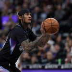 Feb 5, 2025; Salt Lake City, Utah, USA; Utah Jazz guard Jordan Clarkson (00) shoots a technical foul shot against the Golden State Warriors during the first quarter at Delta Center.