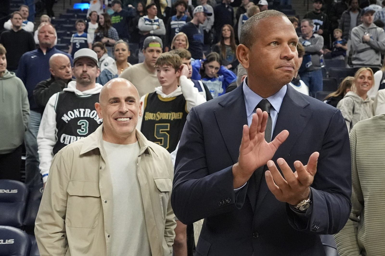 Mar 28, 2025; Minneapolis, Minnesota, USA; Minnesota Timberwolves minority owners Marc Lore and Alex Rodriguez celebrate the team's win over the Phoenix Suns at Target Center. Mandatory Credit: