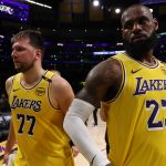 Apr 22, 2025; Los Angeles, California, USA; Los Angeles Lakers guard Luka Doncic (77) and Los Angeles Lakers forward LeBron James (23) leave a court after defeating the Minnesota Timberwolves 94-85 in game two of first round for the 2024 NBA Playoffs at Crypto.com Arena. Mandatory Credit: Kiyoshi Mio-Imagn Images