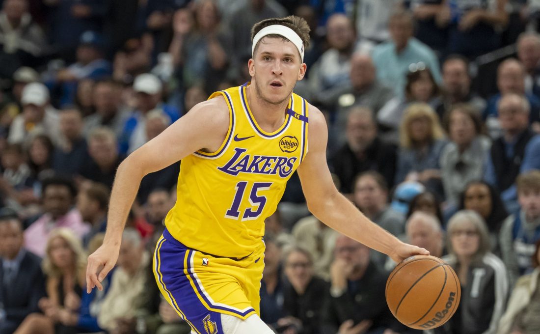 Apr 25, 2025; Minneapolis, Minnesota, USA; Los Angeles Lakers guard Austin Reaves (15) dribbles the ball against the Minnesota Timberwolves during game three of first round for the 2024 NBA Playoffs at Target Center.