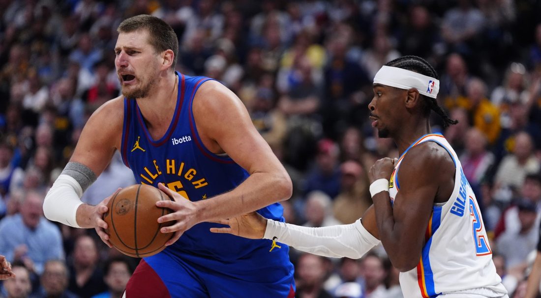 May 9, 2025; Denver, Colorado, USA; Oklahoma City Thunder guard Shai Gilgeous-Alexander (2) defends on Denver Nuggets center Nikola Jokic (15) in the second half during game three of the second round for the 2025 NBA Playoffs at Ball Arena.