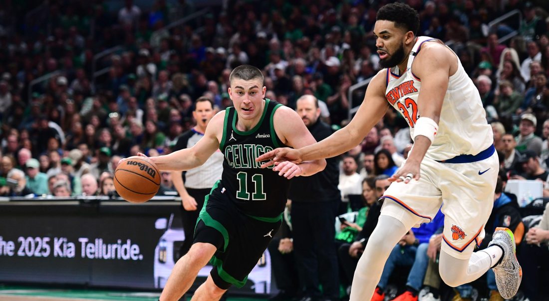 May 14, 2025; Boston, Massachusetts, USA; Boston Celtics guard Payton Pritchard (11) controls the ball while New York Knicks center Karl-Anthony Towns (32) defends in the second half during game five of the second round for the 2025 NBA Playoffs at TD Garden.