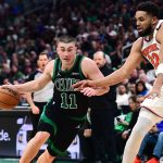 May 14, 2025; Boston, Massachusetts, USA; Boston Celtics guard Payton Pritchard (11) controls the ball while New York Knicks center Karl-Anthony Towns (32) defends in the second half during game five of the second round for the 2025 NBA Playoffs at TD Garden.