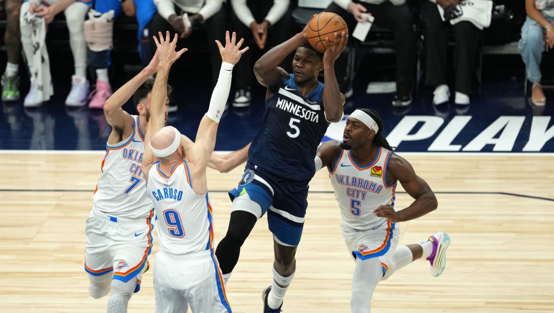 May 26, 2025; Minneapolis, Minnesota, USA; Minnesota Timberwolves guard Anthony Edwards (5) attempts to make a pass against Oklahoma City Thunder guard Alex Caruso (9), guard Luguentz Dort (5) and forward Chet Holmgren (7) in the first half during game four of the western conference finals for the 2025 NBA Playoffs at Target Center.