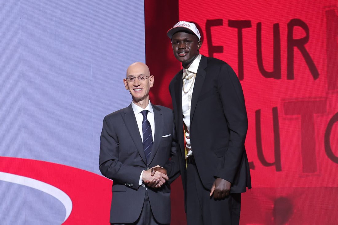 Jun 25, 2025; Brooklyn, NY, USA; Khaman Maluach stands with NBA commissioner Adam Silver after being selected as the tenth pick by the Houston Rockets in the first round of the 2025 NBA Draft at Barclays Center.
