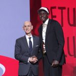 Jun 25, 2025; Brooklyn, NY, USA; Khaman Maluach stands with NBA commissioner Adam Silver after being selected as the tenth pick by the Houston Rockets in the first round of the 2025 NBA Draft at Barclays Center.