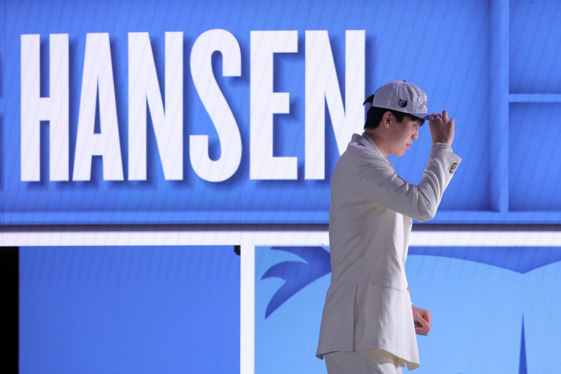 Jun 25, 2025; Brooklyn, NY, USA; Yang Hansen looks on after being selected as the 16th pick by the Memphis Grizzlies in the first round of the 2025 NBA Draft at Barclays