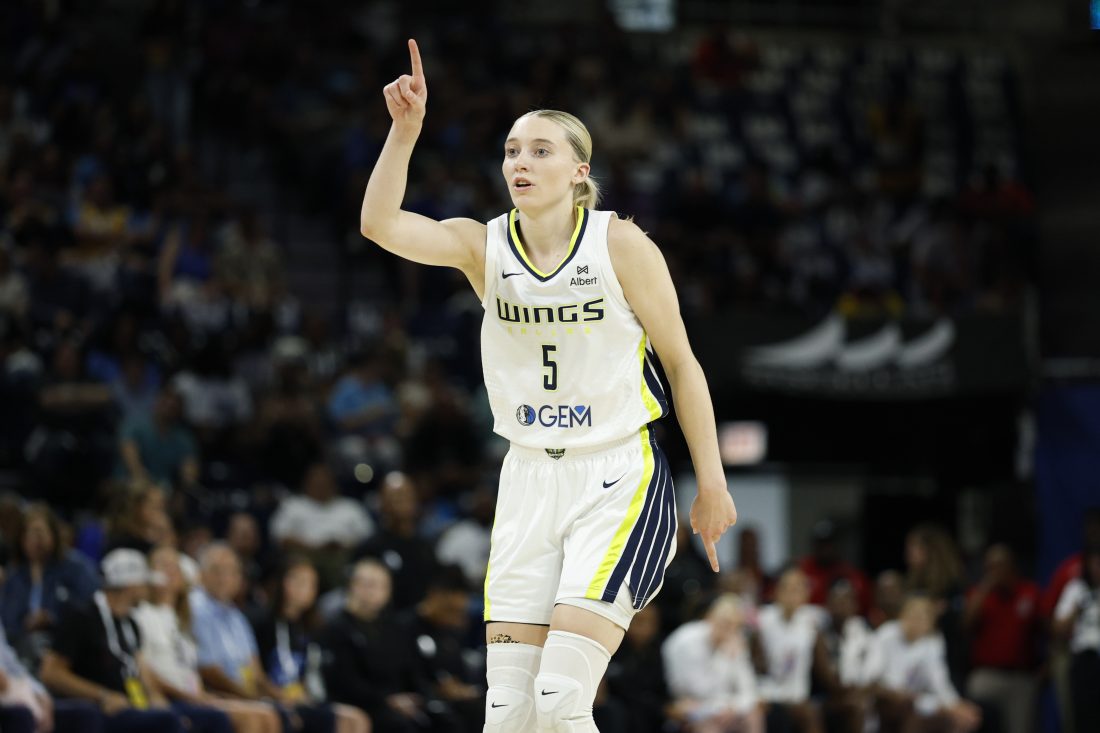 Jul 9, 2025; Chicago, Illinois, USA; Dallas Wings guard Paige Bueckers (5) reacts after scoring against the Chicago Sky during the first half at Wintrust Arena. Mandatory Credit: Kamil Krzaczynski-Imagn Images