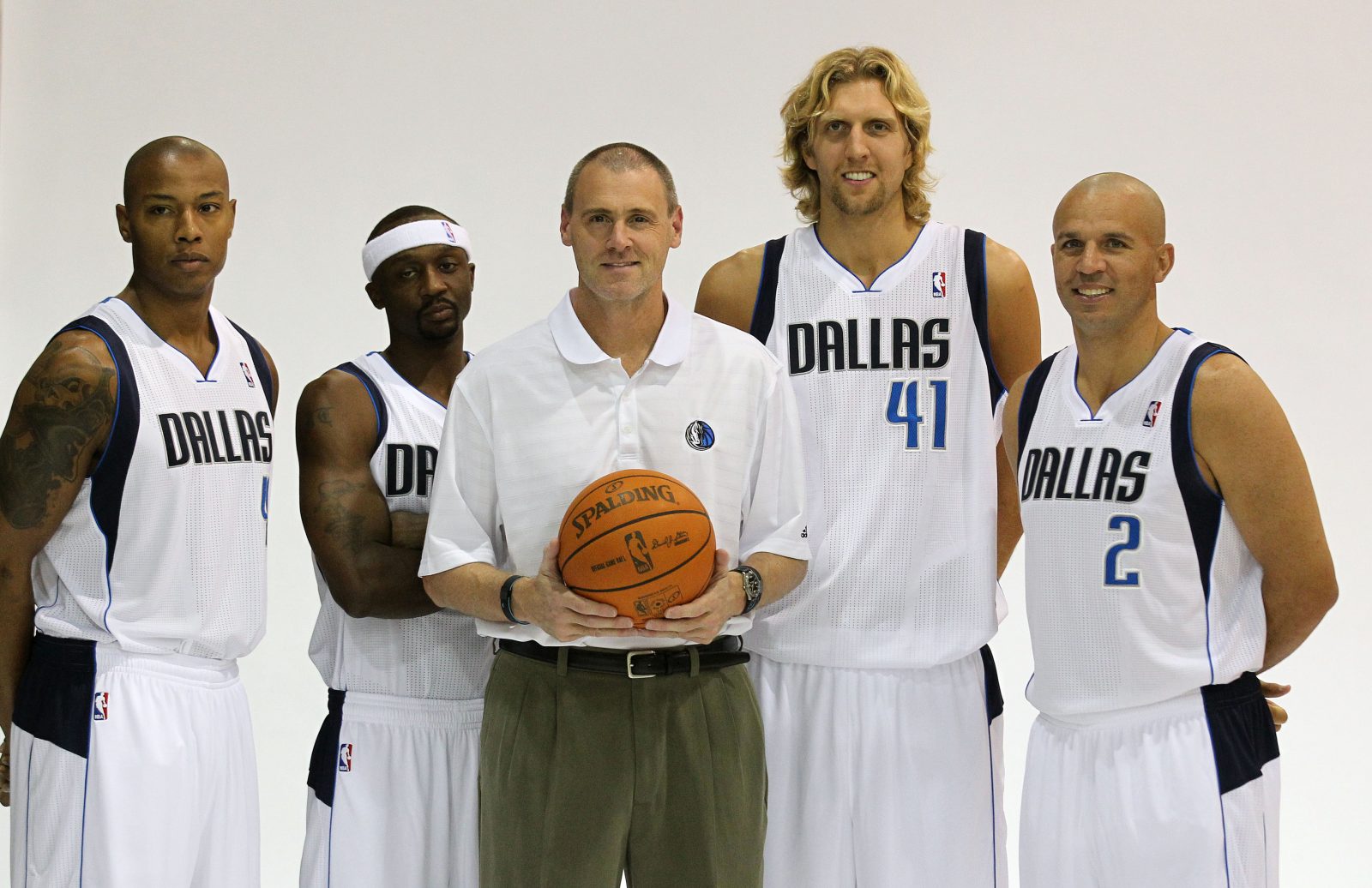 Sep 27, 2010; Dallas, TX, USA; Dallas Mavericks forward Caron Butler (4) guard Jason Terry (31) head coach Rick Carlisle forward Dirk Nowitzki (41) and guard Jason Kidd (2) pose for pictures during media day at American Airlines Center. Mandatory Credit: Matthew Emmons-USA TODAY Sports