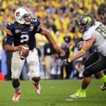 Jan 10, 2011; Glendale, AZ, USA; Auburn Tigers quarterback Cameron Newton (2) is pressured by Oregon Ducks defensive tackle Brandon Bair (88) during the fourth quarter of the 2011 BCS National Championship game at University of Phoenix Stadium. Mandatory Credit: Mark J. Rebilas-USA TODAY Sports