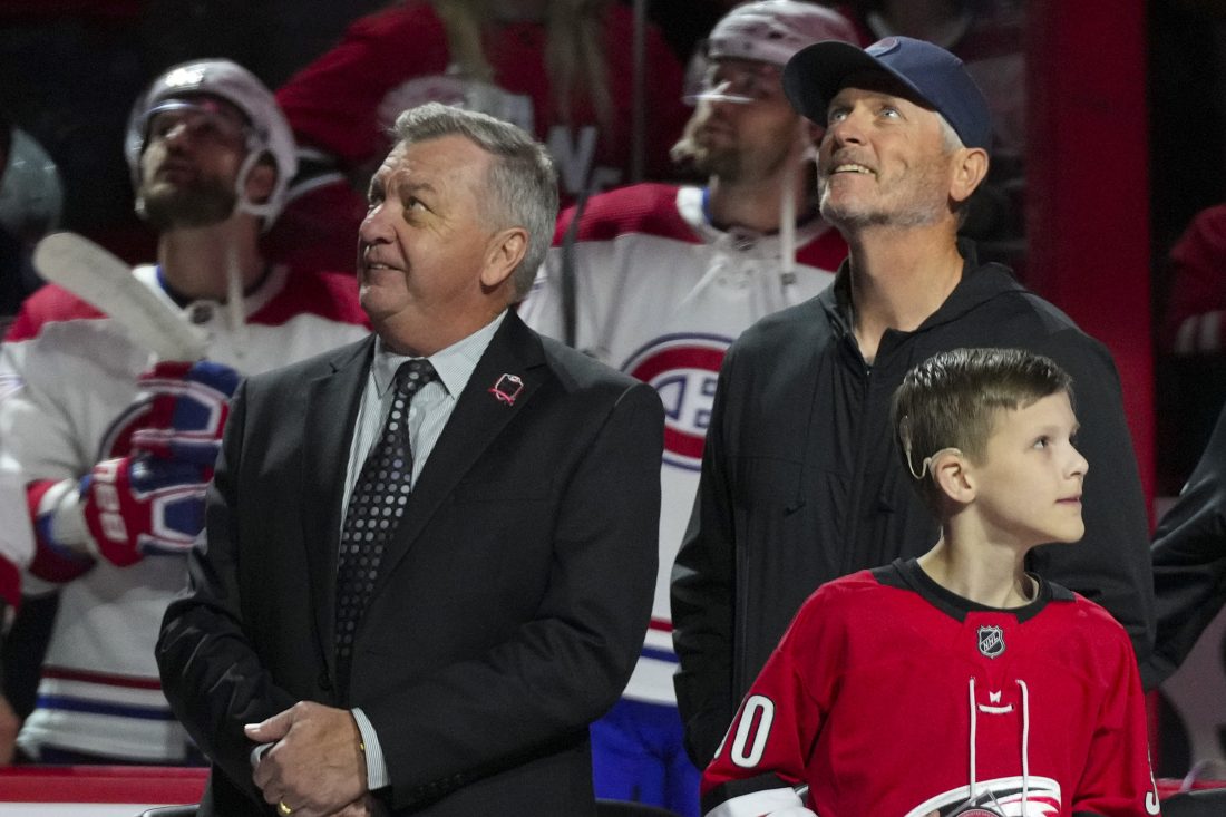 Feb 16, 2023; Raleigh, North Carolina, USA; Carolina Hurricanes GM Don Waddell and Hurricanes owner Tom Dundon look on during the retirement of Cam Ward jersey before the game against the Montreal Canadiens at PNC Arena. Mandatory Credit: James Guillory-USA TODAY Sports
