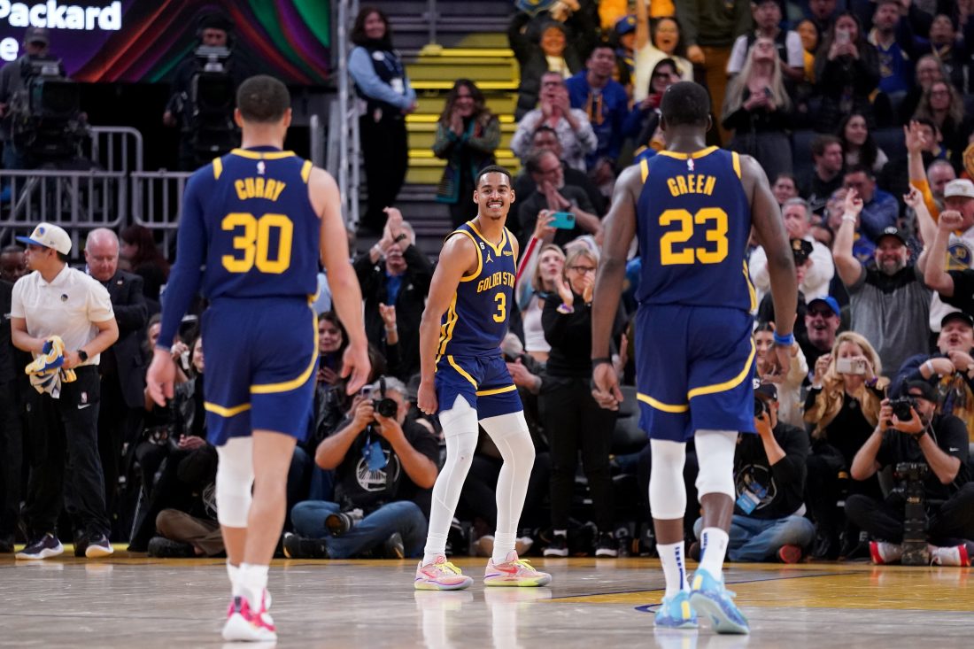 Apr 4, 2023; San Francisco, California, USA; Golden State Warriors guard Jordan Poole (3) reacts in front of guard Stephen Curry (30) and forward Draymond Green (23) after making a three point basket against the Oklahoma City Thunder in the fourth quarter at the Chase Center. Mandatory Credit: Cary Edmondson-USA TODAY Sports