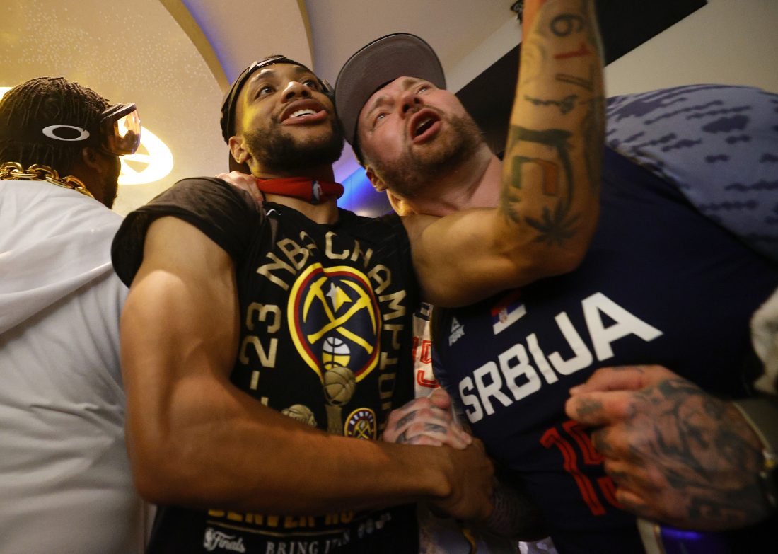Jun 12, 2023; Denver, Colorado, USA; Denver Nuggets forward Bruce Brown (11) celebrates with Strahinja Jokic after the Nuggets won the NBA championship by defeating the Miami Heat in game five of the 2023 NBA Finals at Ball Arena. Mandatory Credit: Isaiah J. Downing-USA TODAY Sports