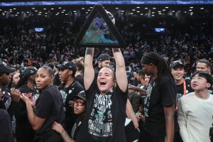 Oct 20, 2024; Brooklyn, New York, USA; New York Liberty guard Sabrina Ionescu (20) celebrates after defeating the Minnesota Lynx in overtime to win the 2024 WNBA Finals at Barclays Center. Mandatory Credit: Wendell Cruz-Imagn Images