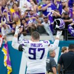 Nov 10, 2024; Jacksonville, Florida, USA; Minnesota Vikings defensive lineman Harrison Phillips (97) celebrates with the fans after the win against the Jacksonville Jaguars at EverBank Stadium. Mandatory Credit: Jeremy Reper-Imagn Images