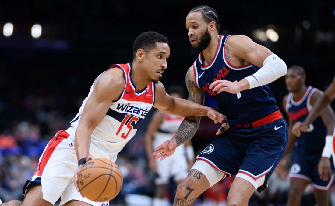 Nov 27, 2024; Washington, District of Columbia, USA; Washington Wizards guard Malcolm Brogdon (15) drives to the basket against LA Clippers guard Amir Coffey (7) during the second quarter at Capital One Arena.