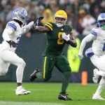 Green Bay Packers running back Josh Jacobs (8) against Detroit Lions safety Kerby Joseph (31) and cornerback Terrion Arnold (0) on Sunday, Nov. 3, 2024, at Lambeau Field in Green Bay. The Lions defeated the Packers 24-14.