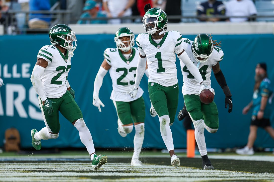 Dec 15, 2024; Jacksonville, Florida, USA; New York Jets cornerback Sauce Gardner (1) celebrates after an interception against the Jacksonville Jaguars in the fourth quarter at EverBank Stadium. Mandatory Credit: Nathan Ray Seebeck-Imagn Images