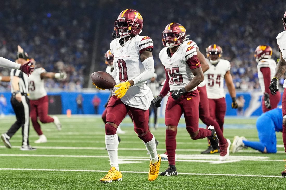 Washington Commanders cornerback Mike Sainristil (0) celebrates an interception against Detroit Lions during the first half of the NFC divisional round at Ford Field in Detroit on Saturday, Jan. 18, 2025.