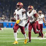 Washington Commanders cornerback Mike Sainristil (0) celebrates an interception against Detroit Lions during the first half of the NFC divisional round at Ford Field in Detroit on Saturday, Jan. 18, 2025.