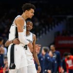 Feb 10, 2025; Washington, District of Columbia, USA; San Antonio Spurs center Victor Wembanyama (1) and guard De'Aaron Fox (4) react during the second quarter against the Washington Wizards at Capital One Arena. Mandatory Credit: Reggie Hildred-Imagn Images