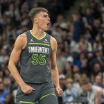 Feb 23, 2025; Minneapolis, Minnesota, USA; Minnesota Timberwolves center Luka Garza (55) reacts after making a three point shot against the Oklahoma City Thunder in the second half at Target Center. Mandatory Credit: Jesse Johnson-Imagn Images