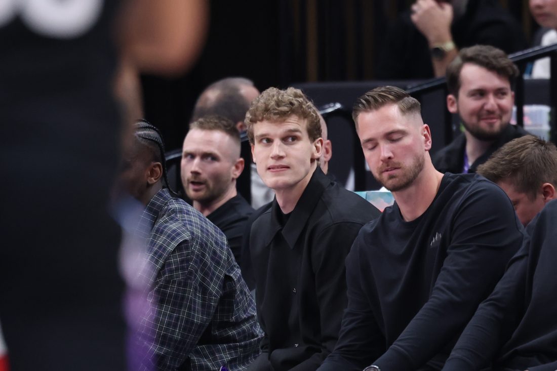 Mar 27, 2025; Salt Lake City, Utah, USA; Utah Jazz forward Lauri Markkanen (center) watches the game from the bench during the second half of the game against the Houston Rockets at Delta Center. Mandatory Credit: Rob Gray-Imagn Images