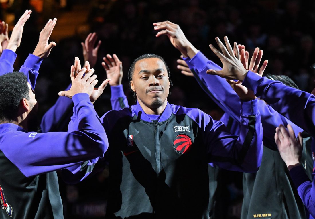 Mar 28, 2025; Toronto, Ontario, CAN; Toronto Raptors forward Scottie Barnes (4) is greeted by team mates during player introductions before tip off against the Charlotte Hornets at Scotiabank Arena. Mandatory Credit: Dan Hamilton-Imagn Images
