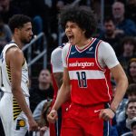 Apr 8, 2025; Indianapolis, Indiana, USA; Washington Wizards forward Kyshawn George (18) celebrates a made basket in the first half against the Indiana Pacers at Gainbridge Fieldhouse.