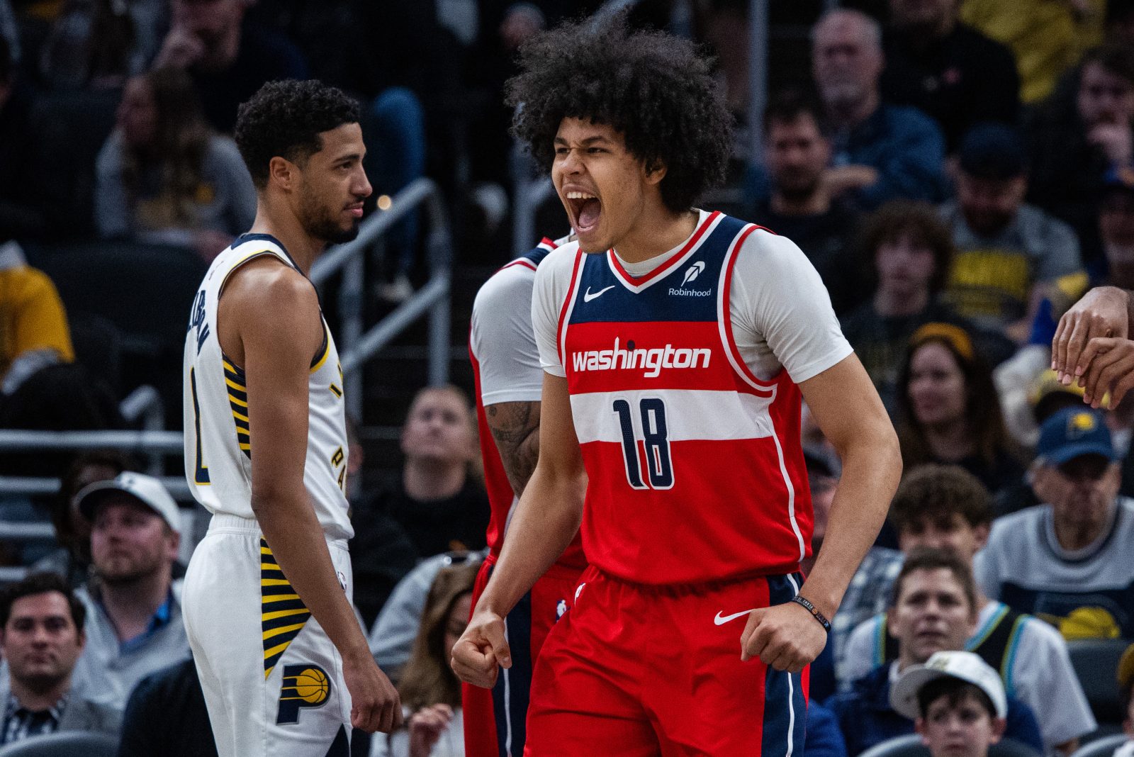 Apr 8, 2025; Indianapolis, Indiana, USA; Washington Wizards forward Kyshawn George (18) celebrates a made basket in the first half against the Indiana Pacers at Gainbridge Fieldhouse.
