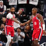 Apr 8, 2025; Inglewood, California, USA; LA Clippers forward Derrick Jones Jr. (55) and guard Kris Dunn (8) celebrate against the San Antonio Spurs in the first half at Intuit Dome. Mandatory Credit: Kirby Lee-Imagn Images