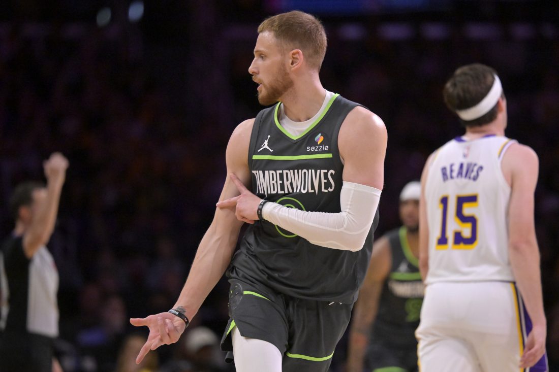 Apr 19, 2025; Los Angeles, California, USA; Minnesota Timberwolves guard Donte DiVincenzo (0) celebrates after a 3-point basket in the first half against the Los Angeles Lakers at Crypto.com Arena. Mandatory Credit: Jayne Kamin-Oncea-Imagn Images