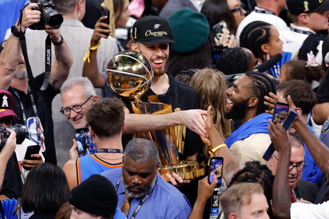 Jun 22, 2025; Oklahoma City, Oklahoma, USA; Oklahoma City Thunder forward Chet Holmgren (7) holds the NBA Finals Larry O'Brien Championship Trophy at the end of game seven of the 2025 NBA Finals at Paycom Center. Mandatory Credit: Alonzo Adams-Imagn Images