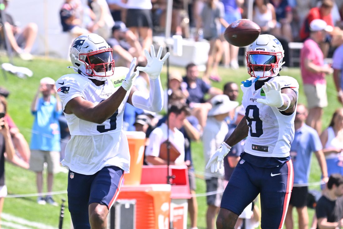 Jul 28, 2025; Foxborough, MA, USA; New England Patriots wide receiver Kayshon Boutte (9) does a drill with wide receiver Stefon Diggs (8) during training camp at Gillette Stadium. Mandatory Credit: Eric Canha-Imagn Images