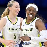 Jul 28, 2025; Arlington, Texas, USA; Dallas Wings guard Paige Bueckers (5) and guard Arike Ogunbowale (24) celebrate during the second half against the New York Liberty at College Park Center. Mandatory Credit: Jerome Miron-Imagn Images