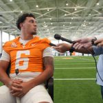 Knox News reporter Adam Sparks speaks to Tennessee quarterback Joey Aguilar (6) during football media day, in Knoxville, Tennessee, July 29, 2025.