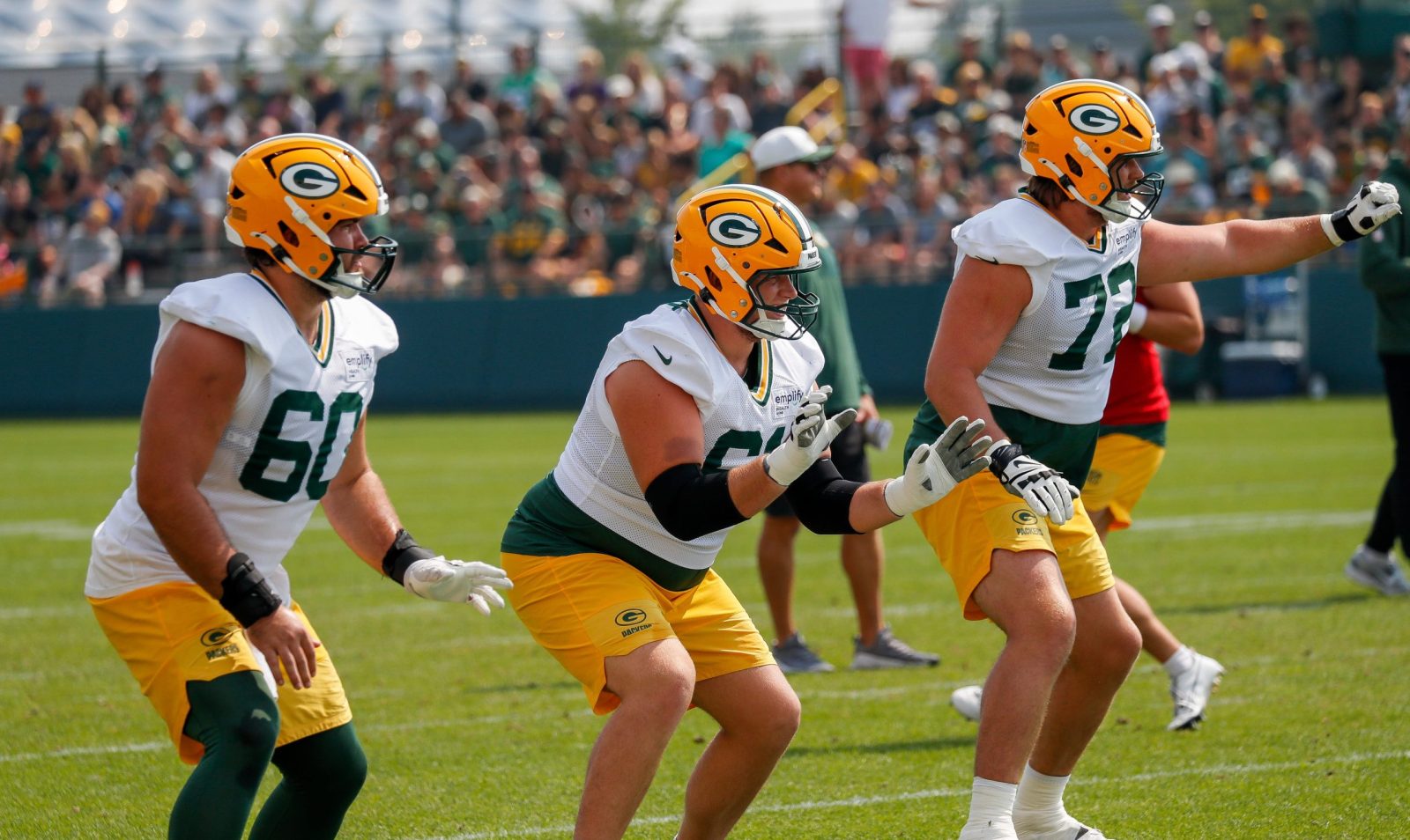 Green Bay Packers offensive linemen Tyler Cooper (60), JJ Lippe (61) and Brant Banks (72) run through a drill during practice on Friday, August 1, 2025, at Ray Nitschke Field in Ashwaubenon, Wis.