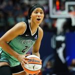 Aug 1, 2025; Uncasville, Connecticut, USA; New York Liberty forward Isabelle Harrison (21) looks to pass the ball against the Connecticut Sun in the second half at Mohegan Sun Arena. Mandatory Credit: David Butler II-Imagn Images