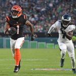 Aug 7, 2025; Philadelphia, Pennsylvania, USA; Cincinnati Bengals wide receiver Ja'Marr Chase (1) runs past Philadelphia Eagles cornerback Kelee Ringo (7) on a 36-yard touchdown catch during the first quarter against the Philadelphia Eagles at Lincoln Financial Field.