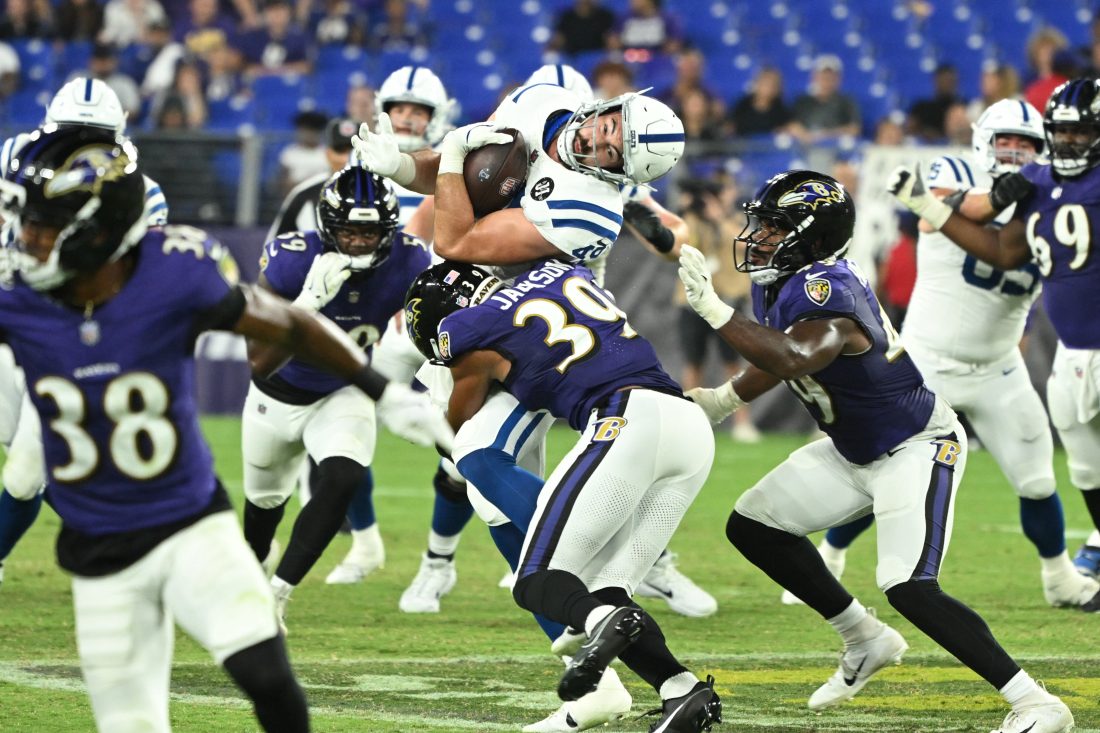 Aug 7, 2025; Baltimore, Maryland, USA; Indianapolis Colts tight end Sean McKeon (49) is tackled by Baltimore Ravens safety Keondre Jackson (39) during the fourth quarter at M&T Bank Stadium. Mandatory Credit: Rafael Suanes-Imagn Images