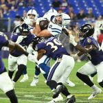 Aug 7, 2025; Baltimore, Maryland, USA; Indianapolis Colts tight end Sean McKeon (49) is tackled by Baltimore Ravens safety Keondre Jackson (39) during the fourth quarter at M&T Bank Stadium. Mandatory Credit: Rafael Suanes-Imagn Images