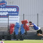 Bills edge A.J. Epenesa hits the blocking sled as he puts in reps alone on the practice field during the second day of Buffalo Bills training camp at St. John Fisher University Thursday, July 24, 2025 in Pittsford.