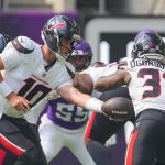 Aug 9, 2025; Minneapolis, Minnesota, USA; Houston Texans quarterback Davis Mills (10) hands the ball off to running back Dare Ogunbowale (33) against the Minnesota Vikings in the first quarter at U.S. Bank Stadium. Mandatory Credit: Brad Rempel-Imagn Images